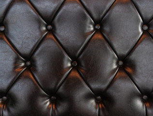 Obraz premium Elegant luxury dark brown leather with buttons. Leather pattern texture background