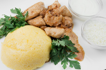 Mamaliaga or polenta with cheese and pork meat. Traditional food of Moldovan and Romanian.
