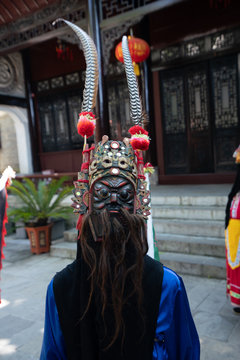 Fototapeta Miao person wearing traditional mask