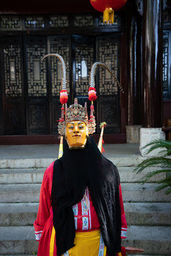 Fototapeta Miao person wearing traditional mask