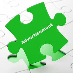 Advertising concept: Advertisement on Green puzzle pieces background, 3D rendering