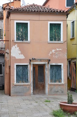 Fototapeta na wymiar Front view of old house on venetian island Burano