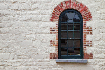 Fototapeta premium Vintage style stone wall and brick window design background