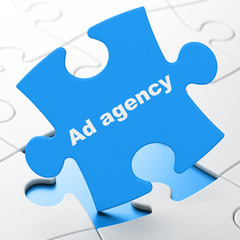 Advertising concept: Ad Agency on Blue puzzle pieces background, 3D rendering