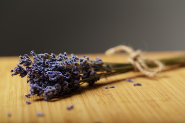 Obraz na płótnie Canvas Bunch of dried lavender on wooden background