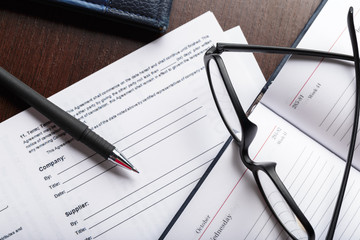 Close up shot of Eyeglasses  on document papers business concept