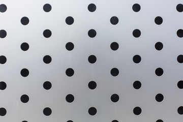 black circles on a metal surface pattern texture background