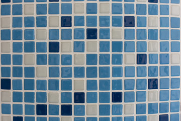 blue square ceramic tiles in the pool or bathroom pattern texture background