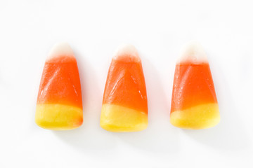 Typical halloween candy corn isolated on white background. Top view.  © chandlervid85