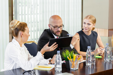 Business people working together at conference table