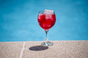 red drink drink on the floor swimming pool
