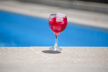 red drink drink on the floor swimming pool