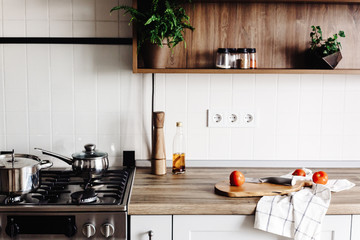 Cooking on Modern Kitchen  in scandinavian style. stylish kitchen interior with modern furniture...