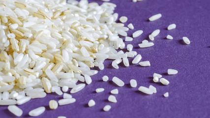 Brown and white rice grains. Food background. Close up