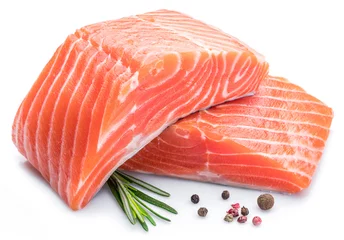 Poster Fresh raw salmon fillets on white background. © volff