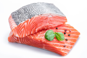 Fresh raw salmon fillets  decorated with green basil.