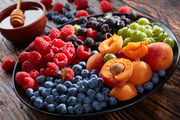 Naklejka na ściany i meble Fruit and berries platter, top view
