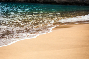 Soft beautiful ocean wave on sandy beach on Tenerife Canary Island, Spain