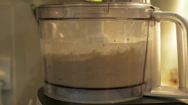 Mixing pizza dough in food processer