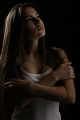 young adult sexy woman in a white tank top