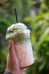Ice milk green tea in plastic glass