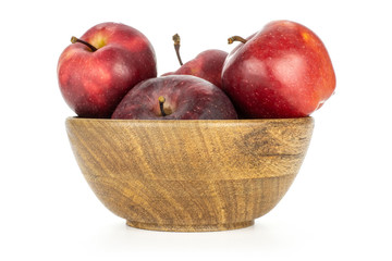 Juicy apples red delicious in a wooden bowl isolated on white background.