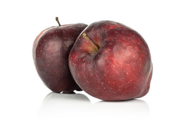 Two red delicious apples deep red isolated on white background.