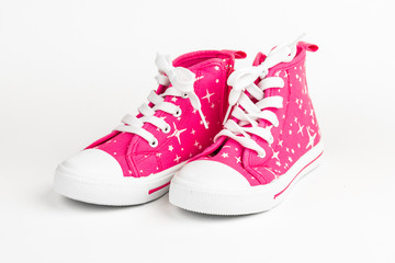 Red children's shoes. On white background.