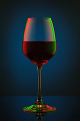 Coloful wineglass on table.
