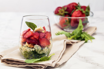Spinach salad in glass.