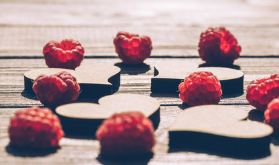 Retro background. Hearts and raspberries