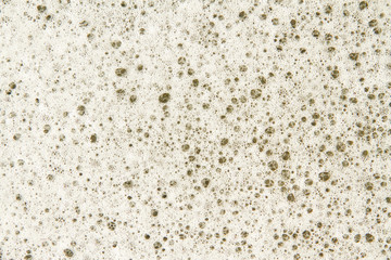 Close up of a lot of White suds on water.