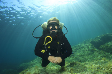 Naklejka na ściany i meble Blonde woman scuba diver 