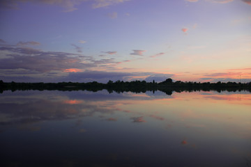 Purple sunset - sky reflect in calm lake