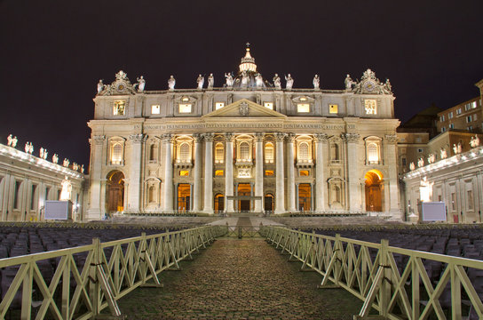 Night time image of St. Peter’s Basilica in Vatican City.