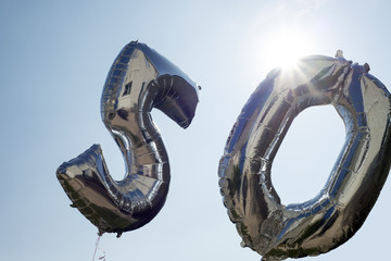 two silver balloons for a 50th