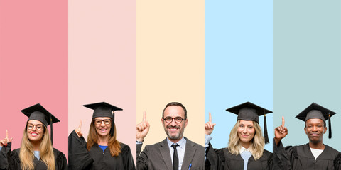 Senior teacher with his graduate students raising finger, the number one