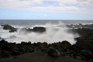 Reunion island seascape, landscape. Black sand, volcanic rocks.