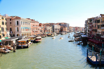 Fototapeta na wymiar Boats along the Grand Canal of Venice in daylight.