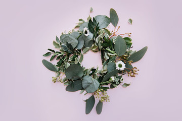 Beautiful fresh green nest or wreath made out of eucalyptus leaves, green branches and little cute...