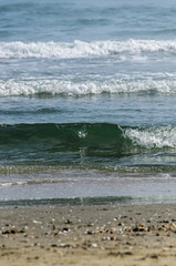 Beach of Black Sea from Mamaia, Romania with blue clear water and golden sand