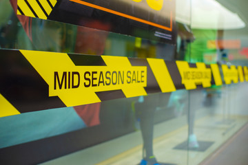 Sale in the middle of the season, the inscription about discounts in the shopping center. Discount Promotion Selling Concept