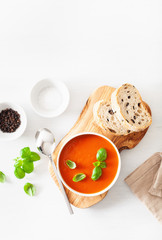tomato soup flat lay on white backgorund