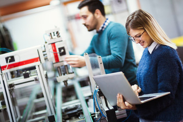 Young students of electronics working on project