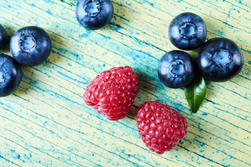 Ripe fresh raspberry and blueberry close up