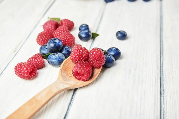 Ripe fresh raspberry and blueberry close up