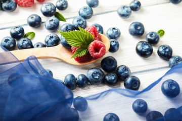 Ripe fresh raspberry and blueberry close up