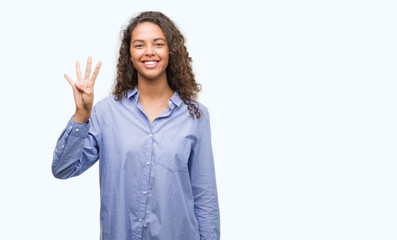 Young hispanic business woman showing and pointing up with fingers number four while smiling confident and happy.