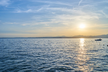 Fototapeta premium Spectacular sunset with beautiful light at City of Bardolino / Lake Garda in Italy
