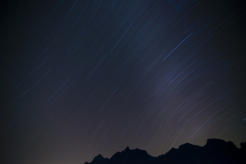 long exposure star trail over mountain in dawn